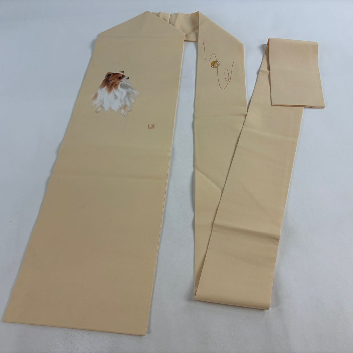 【美品】 名古屋帶 逸品級 落款あり 犬 鈴 漸層 薄橙 純蠶絲