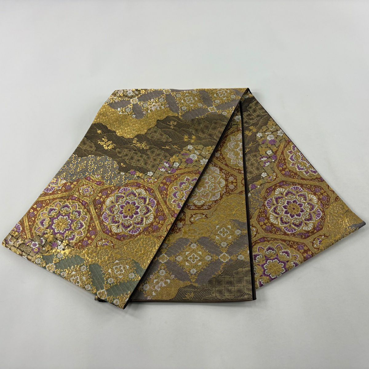 【美品】 袋帶 逸品級 じゅらく 落款あり 帝王紫 道長取 蜀江華紋 金金箔 金絲 焦茶 お太鼓柄 純蠶絲