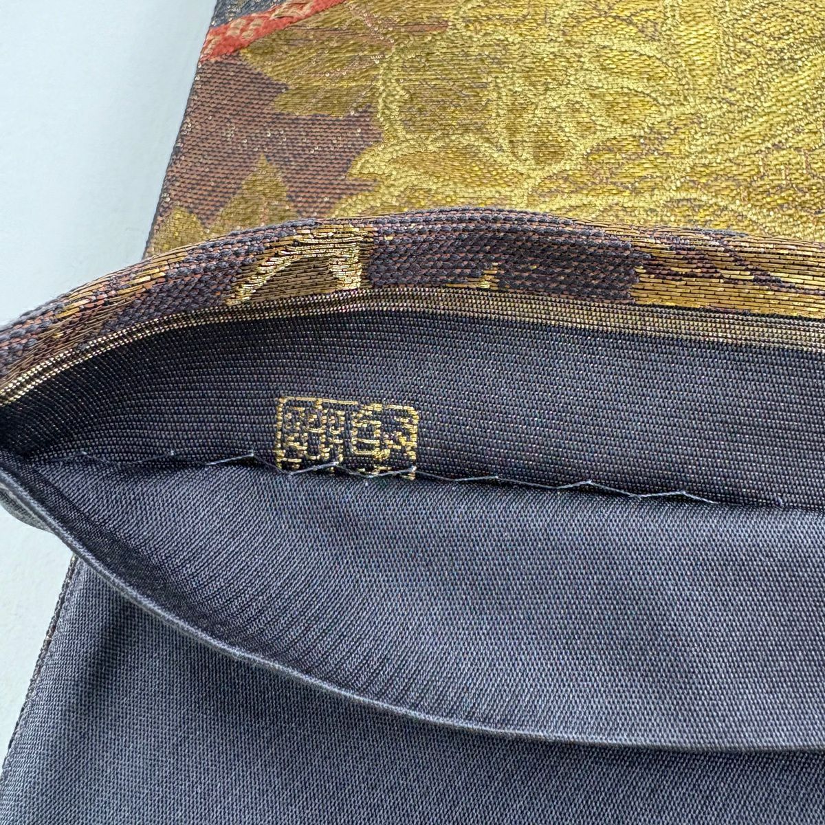 【美品】 袋帶 名品級 じゅらく 落款あり 花唐草紋 蜀江文 金金箔 金絲 茶紫 六通 純蠶絲