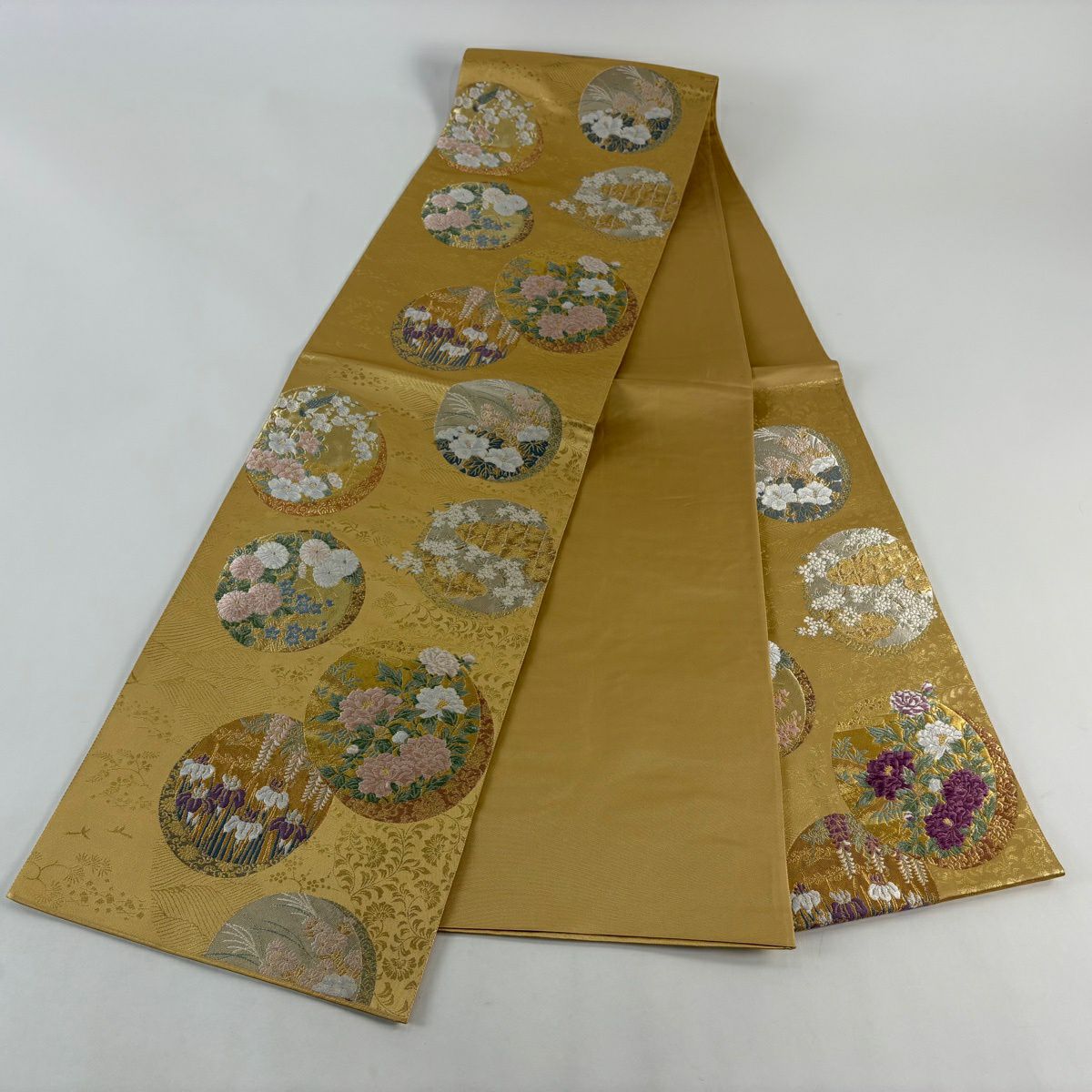 【美品】 袋帶 逸品級 じゅらく 落款あり じゅらく帝王紫 圓文 草花紋紋 金銀彩 金金箔 淺黃土色 大鼓圖案 純蠶絲