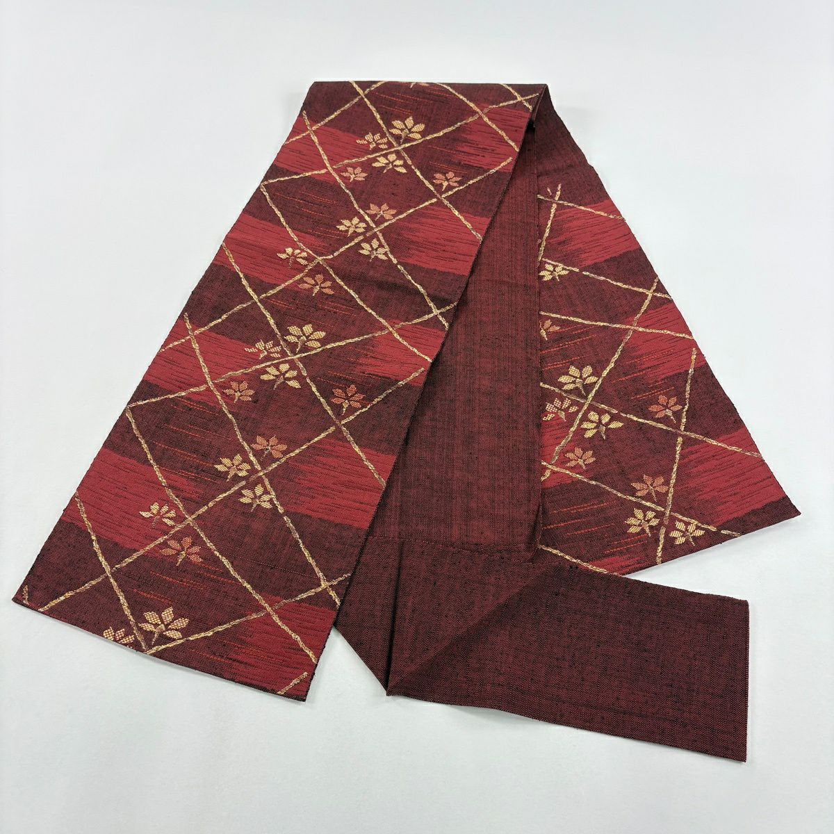 【美品】 名古屋帶 優品級 紬織織 松樹葉仕立 八寸名古屋帶 草花紋紋 幾何學圖案 深紅 純蠶絲