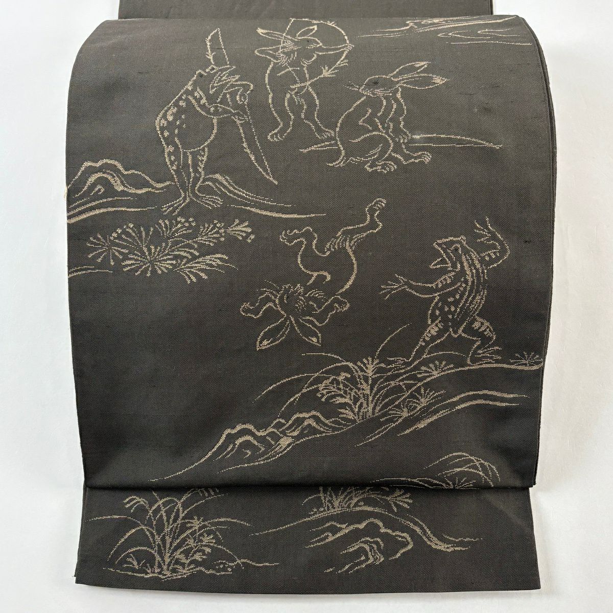 袋帶 逸品級 紬織織 鳥獸戲畫 焦茶 お太鼓紋 純蠶絲